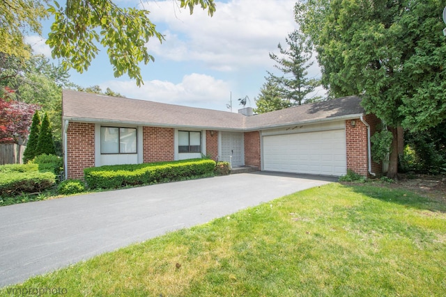 771 E Devon Ave, Roselle, IL 60172 - single story home featuring an attached garage, driveway, brick siding, and a front lawn