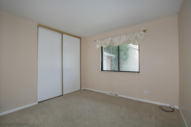 771 E Devon Ave, Roselle, IL 60172 - unfurnished bedroom featuring carpet floors and a closet