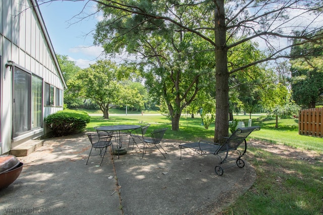 771 E Devon Ave, Roselle, IL 60172 - view of patio / terrace with outdoor dining space and view of wooded area