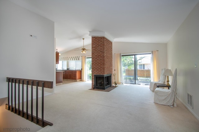 771 E Devon Ave, Roselle, IL 60172 - living room with vaulted ceiling, light carpet, a ceiling fan, and a fireplace