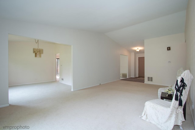 771 E Devon Ave, Roselle, IL 60172 - living area featuring carpet, a chandelier, and lofted ceiling