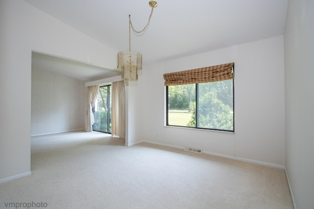 771 E Devon Ave, Roselle, IL 60172 - carpeted spare room featuring a chandelier and baseboards