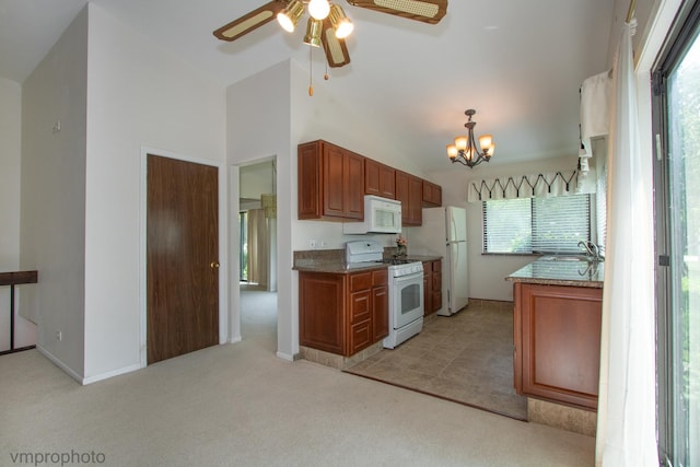 771 E Devon Ave, Roselle, IL 60172 - kitchen with white appliances, a ceiling fan, light colored carpet, a chandelier, and brown cabinetry