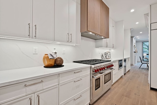 1646 N Orchard St Unit 1S, Chicago, IL 60614 - kitchen with double oven range, light wood-style flooring, recessed lighting, and white cabinetry