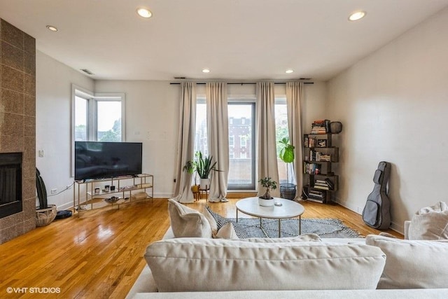 6640 S Maryland Ave Unit 2, Chicago, IL 60637 - living area featuring recessed lighting, wood finished floors, and a tile fireplace