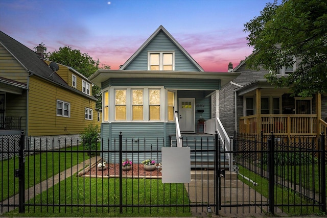 10554 S State St, Chicago, IL 60628 - bungalow-style home with a fenced front yard, a porch, and a gate