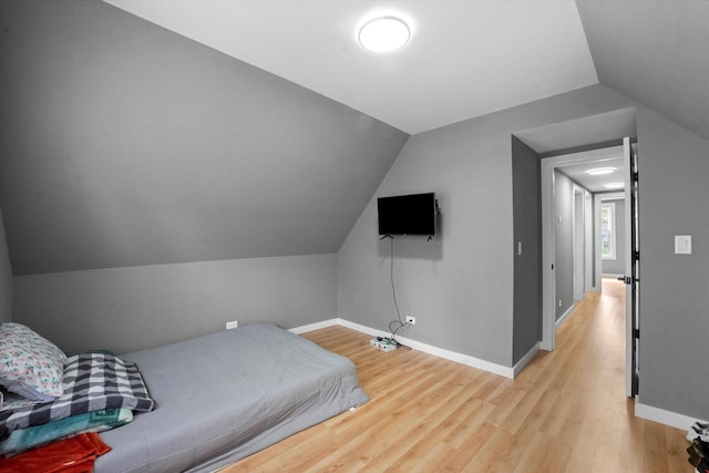 10554 S State St, Chicago, IL 60628 - bedroom with light wood-style floors and vaulted ceiling