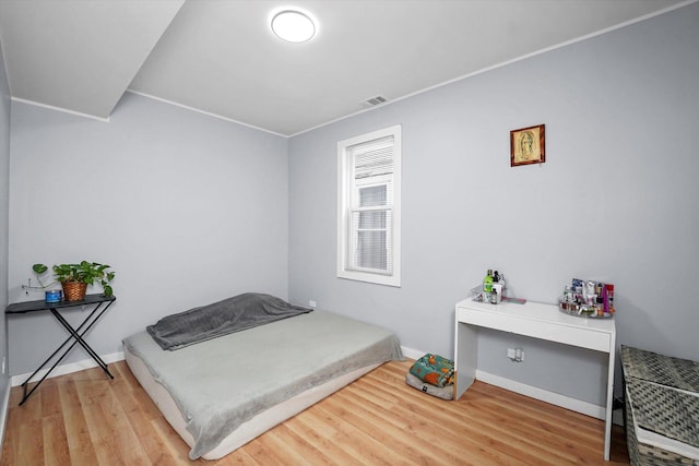 10554 S State St, Chicago, IL 60628 - bedroom featuring wood finished floors and baseboards