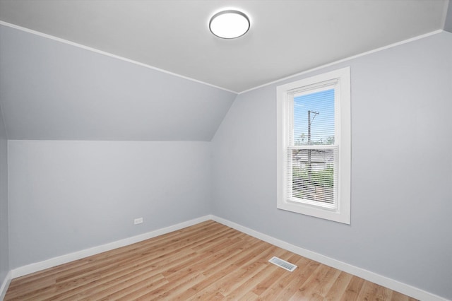 10554 S State St, Chicago, IL 60628 - additional living space with vaulted ceiling and wood finished floors