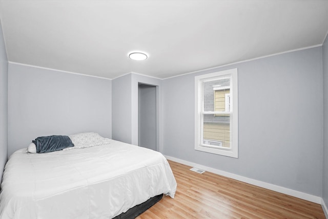 10554 S State St, Chicago, IL 60628 - bedroom featuring wood finished floors and ornamental molding