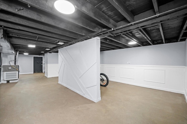 10554 S State St, Chicago, IL 60628 - finished below grade area with wainscoting, heating unit, and a decorative wall
