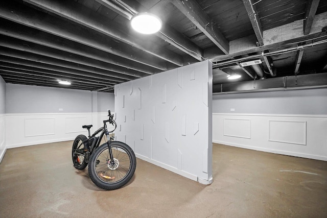 10554 S State St, Chicago, IL 60628 - finished basement with a decorative wall and a wainscoted wall