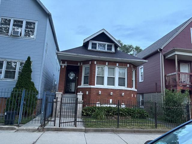 5341 S Aberdeen St, Chicago, IL 60609 - view of front of property with a fenced front yard, a gate, and brick siding