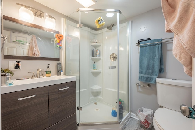 4018 N Maplewood Ave, Chicago, IL 60618 - bathroom featuring a shower stall, vanity, and wood finished floors
