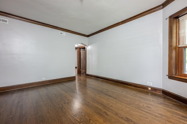 4018 N Maplewood Ave, Chicago, IL 60618 - spare room with crown molding, dark wood-style floors, and arched walkways