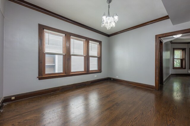 4018 N Maplewood Ave, Chicago, IL 60618 - unfurnished room featuring dark wood-style flooring, a chandelier, and ornamental molding