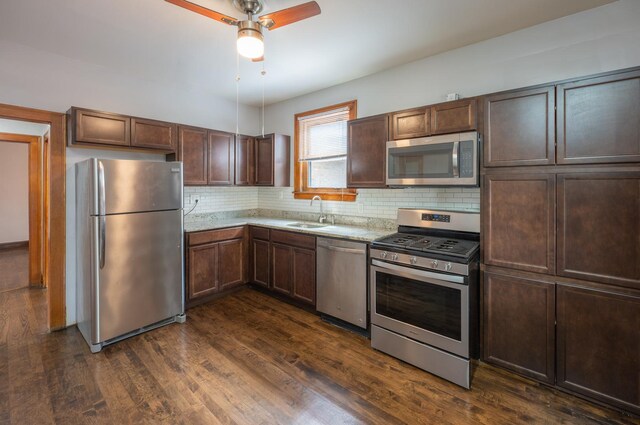 4018 N Maplewood Ave, Chicago, IL 60618 - kitchen featuring stainless steel appliances, decorative backsplash, a ceiling fan, dark wood finished floors, and dark brown cabinetry