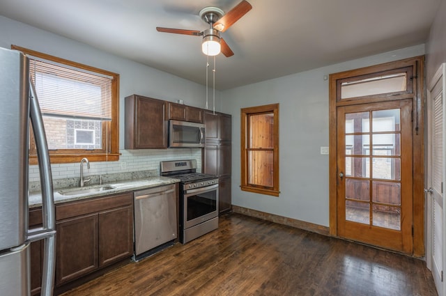 4018 N Maplewood Ave, Chicago, IL 60618 - kitchen with stainless steel appliances, plenty of natural light, backsplash, and dark wood-type flooring