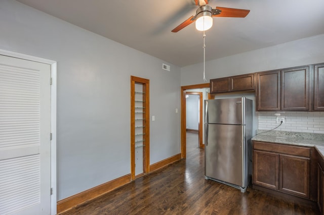 4018 N Maplewood Ave, Chicago, IL 60618 - kitchen featuring freestanding refrigerator, tasteful backsplash, a ceiling fan, dark wood-style floors, and dark brown cabinets