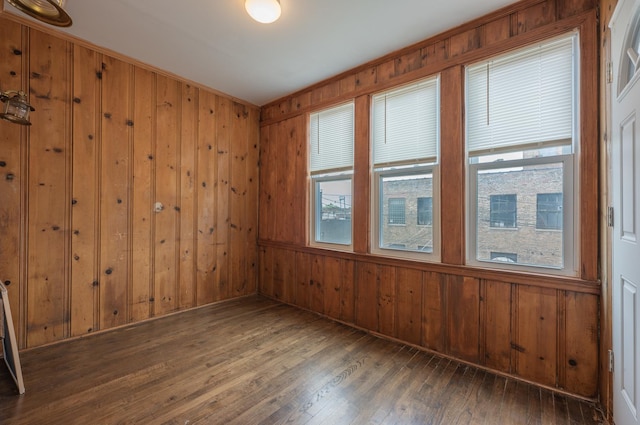 4018 N Maplewood Ave, Chicago, IL 60618 - spare room with wooden walls and hardwood / wood-style floors