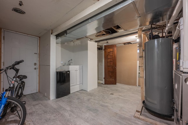4018 N Maplewood Ave, Chicago, IL 60618 - basement with water heater and light wood-style flooring