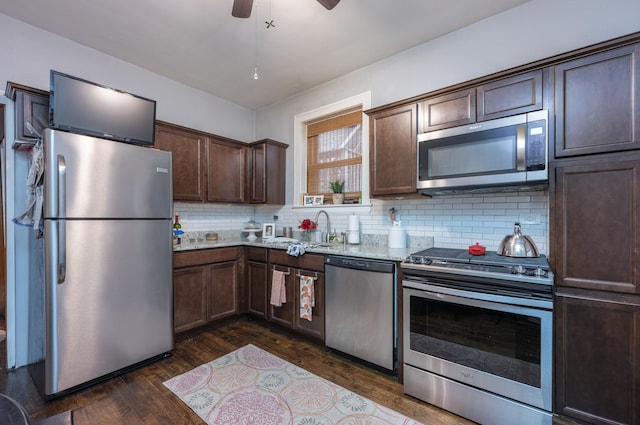 4018 N Maplewood Ave, Chicago, IL 60618 - kitchen with stainless steel appliances, dark wood finished floors, dark brown cabinetry, tasteful backsplash, and light stone counters
