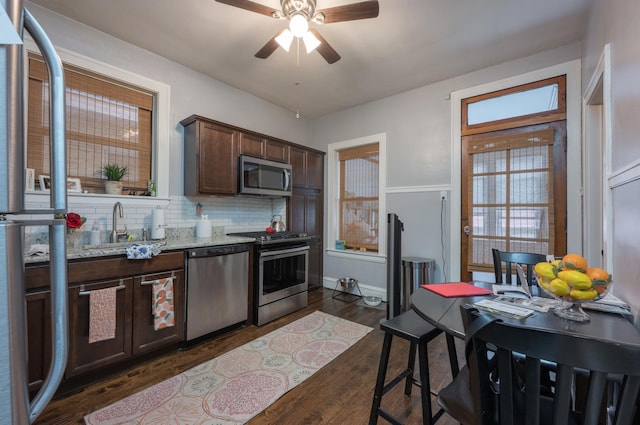 4018 N Maplewood Ave, Chicago, IL 60618 - kitchen with stainless steel appliances, ceiling fan, dark brown cabinetry, and healthy amount of natural light