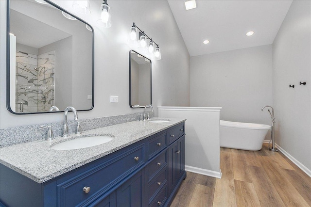 21649 Kent Ct, Frankfort, IL 60423 - bathroom featuring double vanity, wood finished floors, a freestanding bath, a tile shower, and recessed lighting