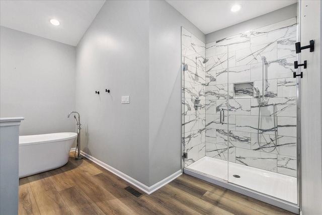 21649 Kent Ct, Frankfort, IL 60423 - bathroom with a freestanding tub, a marble finish shower, wood finished floors, and recessed lighting