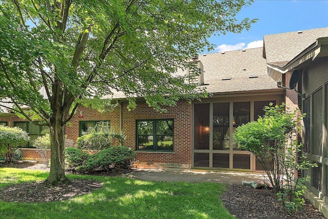 21649 Kent Ct, Frankfort, IL 60423 - rear view of property featuring brick siding, roof with shingles, and a sunroom
