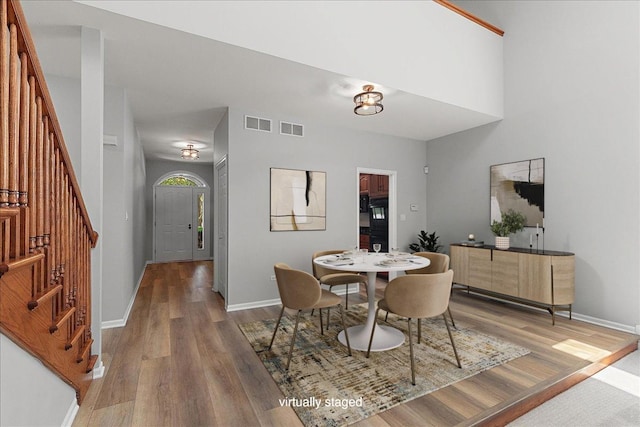 21649 Kent Ct, Frankfort, IL 60423 - dining area with stairway and light wood-style flooring
