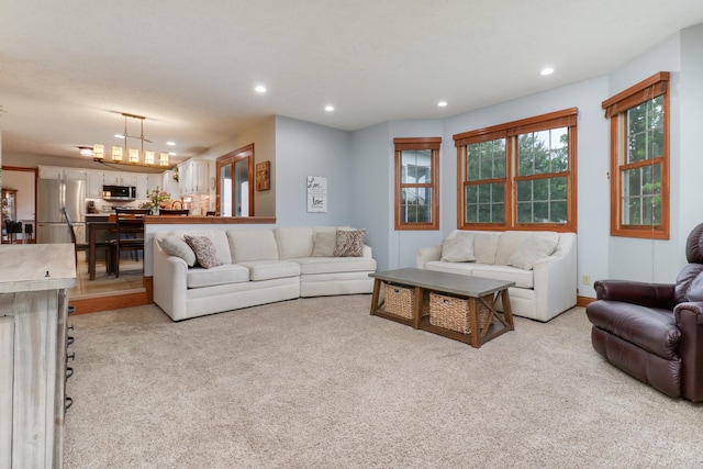 807 Eddy Rd, Bloomington, IL 61704 - living area featuring recessed lighting, light colored carpet, and a chandelier