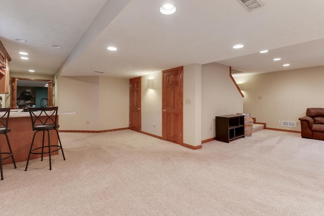 807 Eddy Rd, Bloomington, IL 61704 - unfurnished living room featuring light colored carpet and recessed lighting