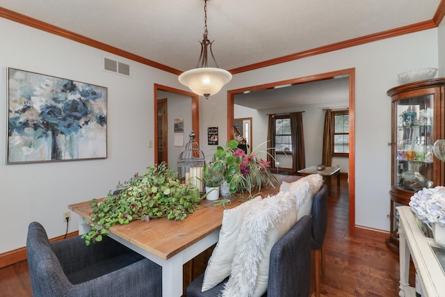 807 Eddy Rd, Bloomington, IL 61704 - dining space featuring dark wood finished floors and ornamental molding