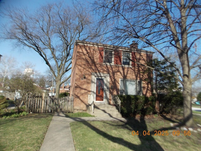 936 Newberry Ave, La Grange Park, IL 60526 - view of front of house featuring brick siding and a chimney