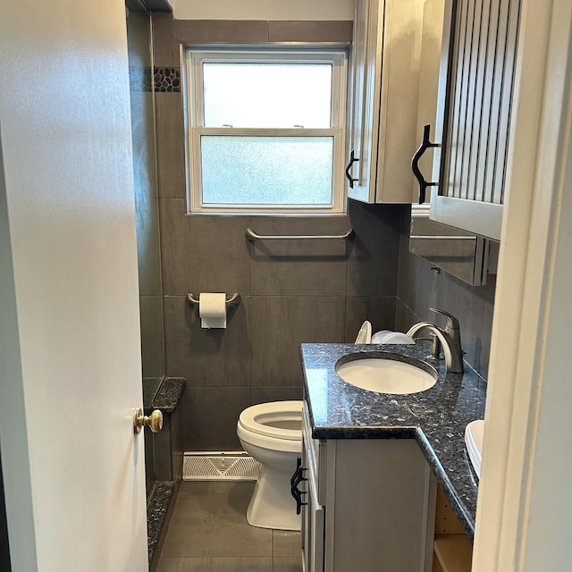 936 Newberry Ave, La Grange Park, IL 60526 - bathroom featuring tile walls, vanity, backsplash, and tile patterned floors