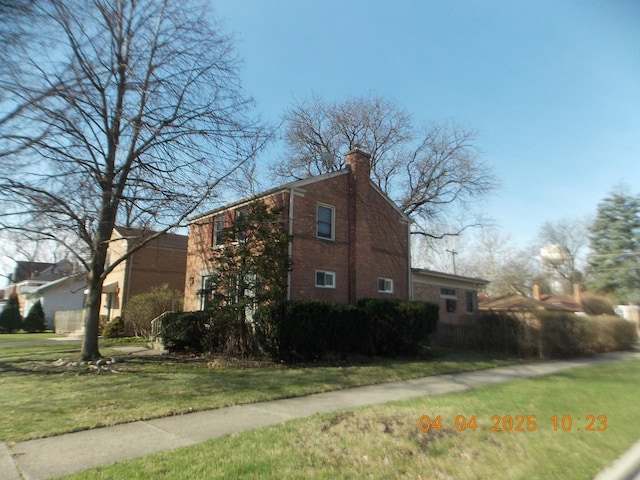 936 Newberry Ave, La Grange Park, IL 60526 - view of property exterior featuring a lawn, a chimney, and brick siding