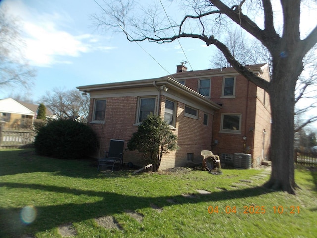 936 Newberry Ave, La Grange Park, IL 60526 - rear view of property featuring brick siding, a yard, and a chimney