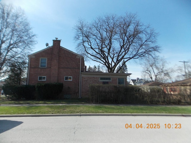 936 Newberry Ave, La Grange Park, IL 60526 - view of side of property featuring brick siding and a chimney