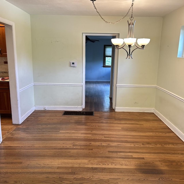 936 Newberry Ave, La Grange Park, IL 60526 - unfurnished dining area featuring dark wood finished floors and a chandelier