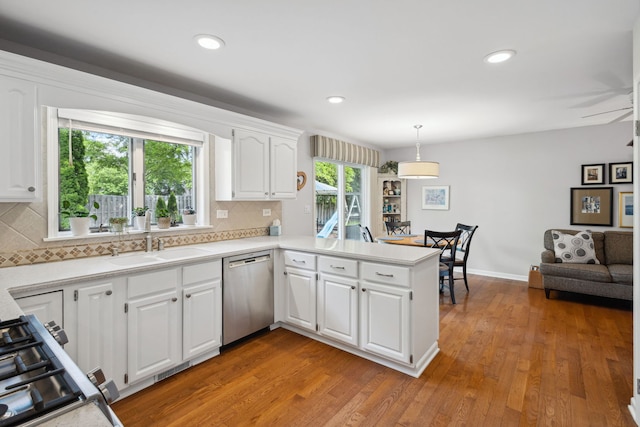1923 N Carlyle Pl, Arlington Heights, IL 60004 - kitchen featuring stainless steel dishwasher, a peninsula, tasteful backsplash, light wood-style flooring, and recessed lighting