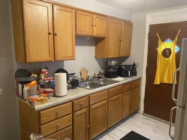 14201/2 Wentworth Ave, Calumet City, IL 60409 - kitchen with freestanding refrigerator, light countertops, and brown cabinetry
