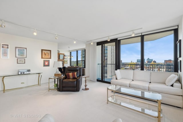 1560 N Sandburg Ter Unit 915, Chicago, IL 60610 - living room featuring rail lighting, carpet flooring, and a city view