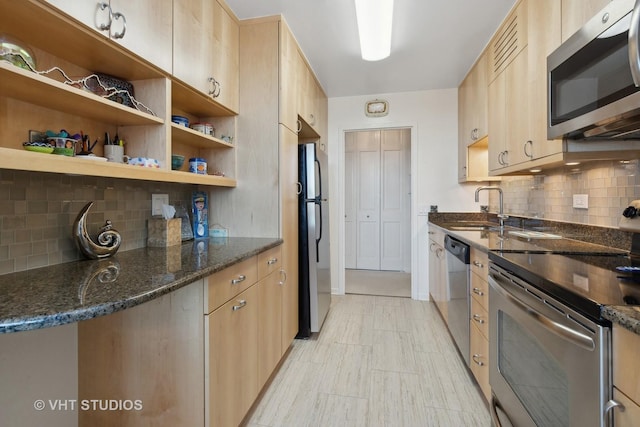 1560 N Sandburg Ter Unit 915, Chicago, IL 60610 - kitchen with stainless steel appliances, light brown cabinets, decorative backsplash, dark stone counters, and open shelves