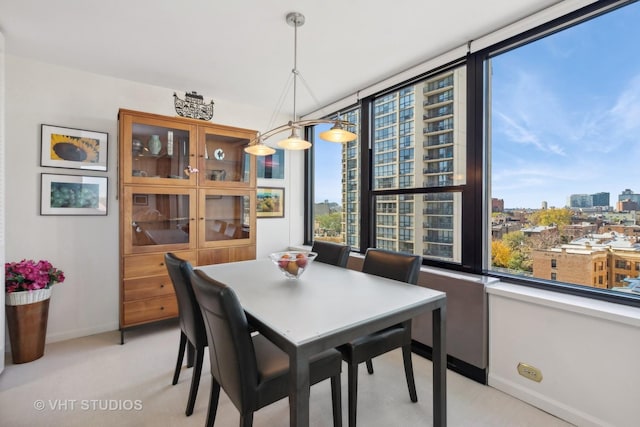 1560 N Sandburg Ter Unit 915, Chicago, IL 60610 - dining room with light colored carpet and a view of city