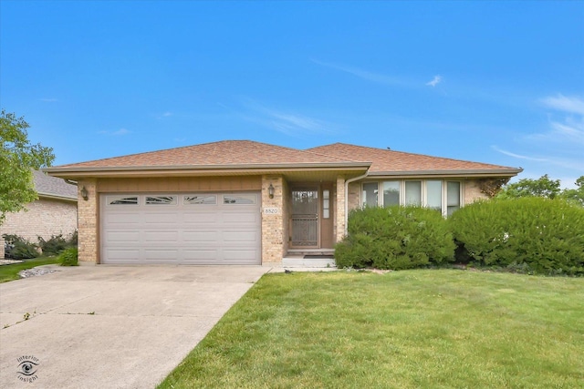 8820 Meadowview Dr, Orland Hills, IL 60487 - view of front facade featuring concrete driveway, brick siding, an attached garage, and a front yard