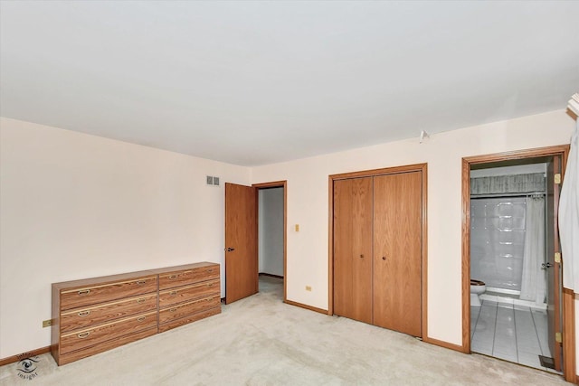 8820 Meadowview Dr, Orland Hills, IL 60487 - unfurnished bedroom featuring light carpet, a closet, and connected bathroom