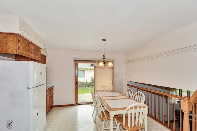 8820 Meadowview Dr, Orland Hills, IL 60487 - dining area featuring light floors and a chandelier