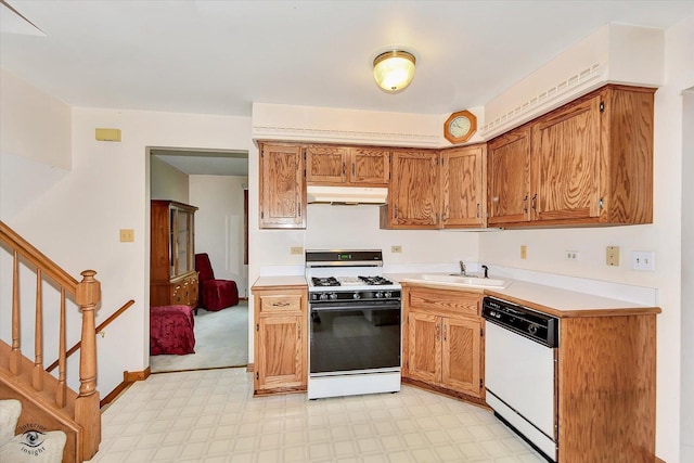 8820 Meadowview Dr, Orland Hills, IL 60487 - kitchen with gas range oven, white dishwasher, light flooring, light countertops, and under cabinet range hood
