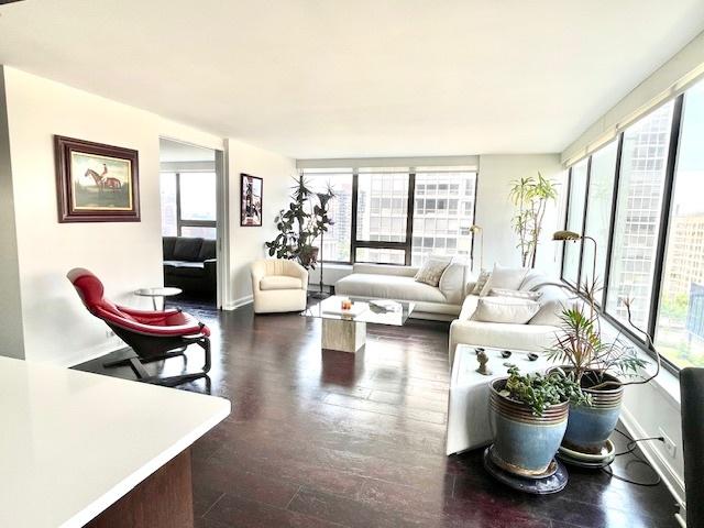 2800 N Lake Shore Dr Unit 1417, Chicago, IL 60657 - living area with healthy amount of natural light and dark wood-type flooring